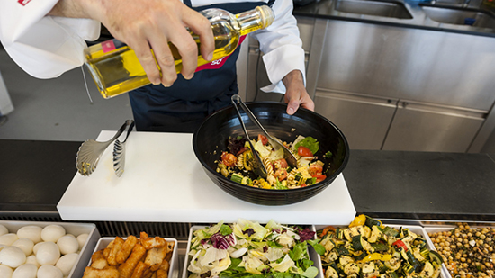 Sodexo chef preparing a salad